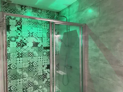 a shower with a glass door in a bathroom at Apartamento Plaza del Cabildo - Sanlúcar Centro in Sanlúcar de Barrameda