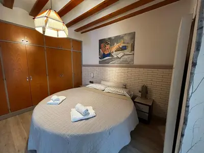 a bedroom with a bed with towels on it at El patio de la Pepa Grupo Ac Gestion in Cádiz