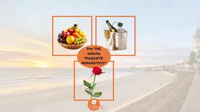 a picture of a beach with a basket of fruit at El patio de la Pepa Grupo Ac Gestion in Cádiz