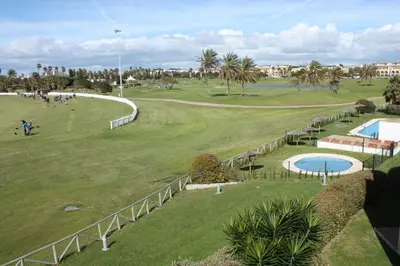 an aerial view of a golf course at a resort at Apartamento Costa Ballena Playa y Golf in Cádiz