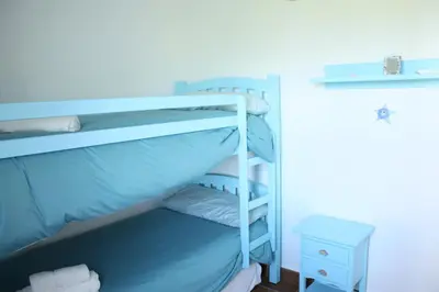 a bunk bed in a room with a bunk bed gmaxwell gmaxwell gmaxwell gmaxwell at Apartamento Costa Ballena Playa y Golf in Cádiz