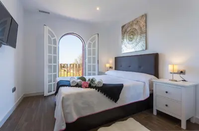 a bedroom with a large bed with flowers on it at 