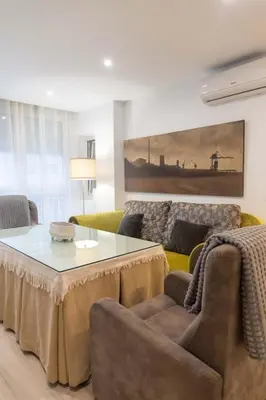 a living room with a coffee table and a couch at Arenas de la Victoria by Gades Gestión in Cádiz