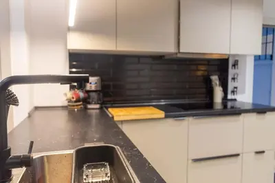 a kitchen with a sink and a counter top at Arenas de la Victoria by Gades Gestión in Cádiz