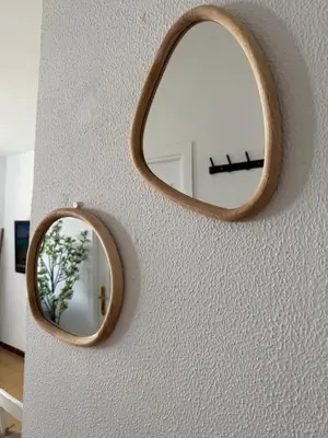 a mirror on a wall with a wooden frame at Vistas al mar primera linea playa Valdelagrana in El Puerto de Santa María