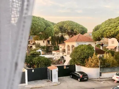 a car parked in a parking lot next to a house at ALOJA Diseño acogedor 3 habitaciones in El Puerto de Santa María