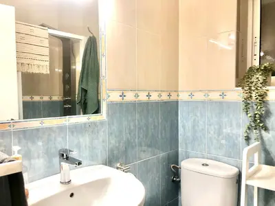 a bathroom with a toilet and a sink at ALOJA Diseño acogedor 3 habitaciones in El Puerto de Santa María