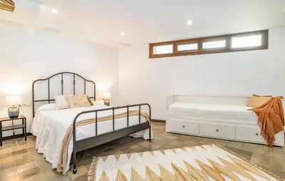 a bedroom with two beds and a window at Beautiful Home In Conil De La Frontera in Conil de la Frontera