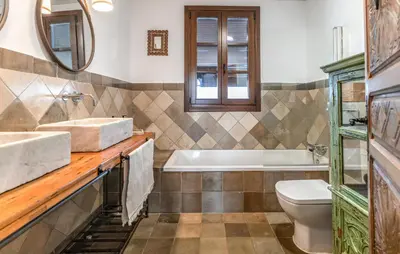 a bathroom with a sink and a tub and a toilet at Beautiful Home In Conil De La Frontera in Conil de la Frontera