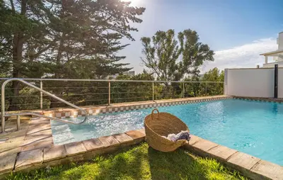 a swimming pool with a basket in a yard at Beautiful Home In Conil De La Frontera in Conil de la Frontera