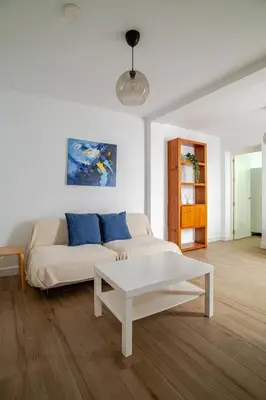 a living room with a couch and a coffee table at Casa con encanto - Wifi, aire acondicionado in Puerto Real