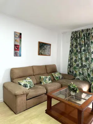 a living room with a couch and a coffee table at Paraíso Frente al Mar en Cádiz in Cádiz