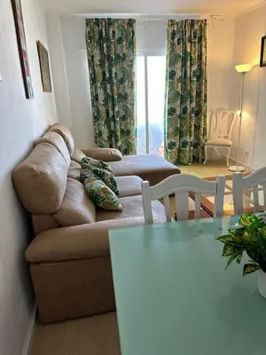 a living room with a couch and a table at Paraíso Frente al Mar en Cádiz in Cádiz