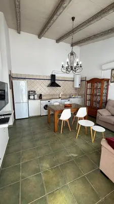 a living room with a table and a couch at Villa Ojos Del Océano in Cádiz
