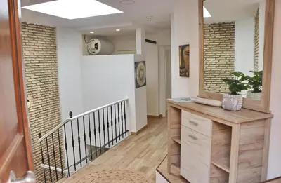 a hallway of a home with a staircase at Apartamento Dúplex Bahia Sur in San Fernando