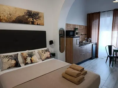 a bedroom with a bed with towels on it at Casa Sahar in Arcos de la Frontera