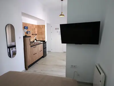 a room with a flat screen tv on a wall at Casa Sahar in Arcos de la Frontera