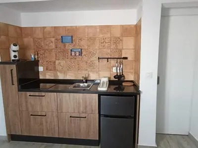 a kitchen with a sink and a counter at Casa Sahar in Arcos de la Frontera