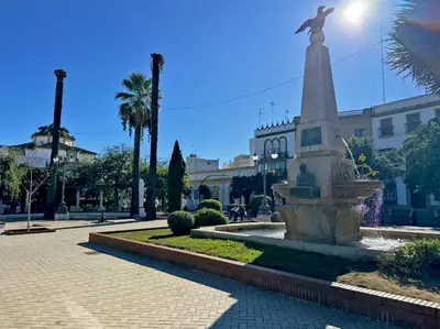 a statue of a bird sitting on top of a fountain at Apartamento Las Palmeras - Ole Solutions in Jerez de la Frontera