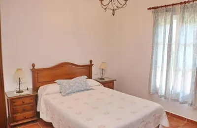 a bedroom with a bed with a pillow on it at Casa Ana in Conil de la Frontera