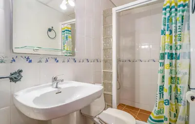 a bathroom with a sink and a toilet and a shower at Amazing Home In La Barca De La Florida in La Barca de la Florida