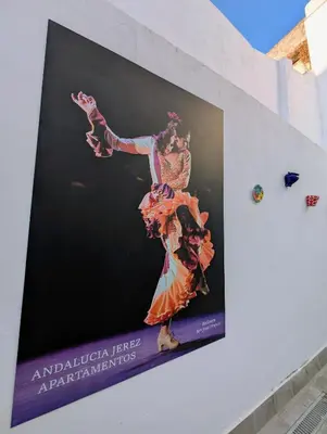 a poster of a dancer on the side of a building at A Jerez Apartamentos in Jerez de la Frontera