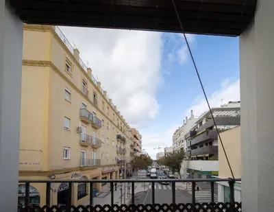 a view of a city street from a balcony at SibsSanlucar Carril San Diego 2 Coqueto Centrico Terraza in Sanlúcar de Barrameda