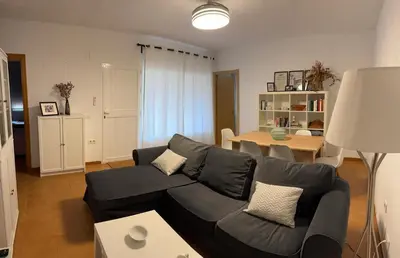 a living room with a couch and a table at Doña Violeta con jardin Grupo AC Gestion in Novo Sancti Petri