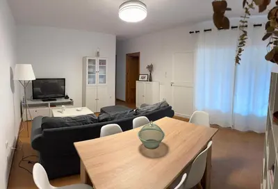 a living room with a couch and a table at Doña Violeta con jardin Grupo AC Gestion in Novo Sancti Petri