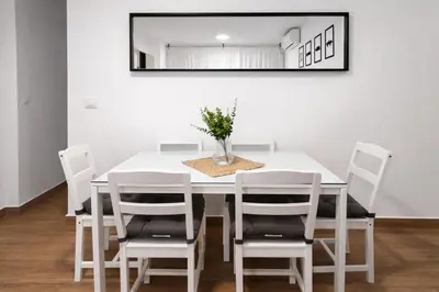 a kitchen with white cabinets and a white refrigerator at CITYHOUSE! NUEVO REFORMADO CONFORT WIFI TV65 AC FULL Visco in San Fernando
