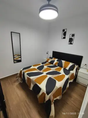 a bedroom with a bed with a cow patterned comforter at CITYHOUSE! NUEVO REFORMADO CONFORT WIFI TV65 AC FULL Visco in San Fernando