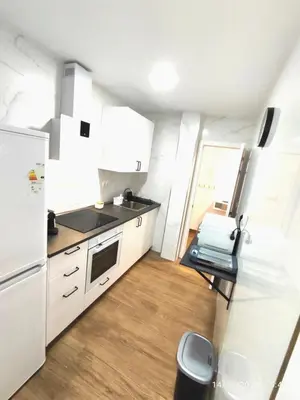 a white dining room table with white chairs and a mirror at CITYHOUSE! NUEVO REFORMADO CONFORT WIFI TV65 AC FULL Visco in San Fernando