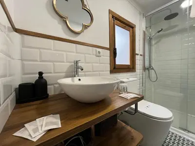 a bathroom with a bowl sink and a toilet at Loft Abril Grupo AC gestion in Cádiz