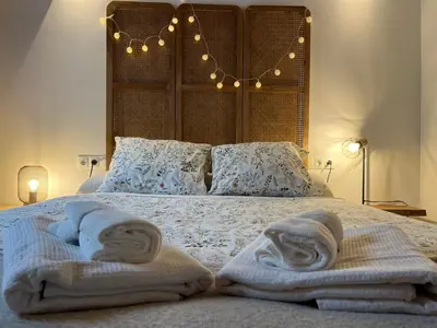 a bed with two towels on top of it at Loft Abril Grupo AC gestion in Cádiz