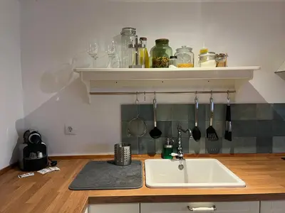 a kitchen with a sink and a counter with utensils at Loft Abril Grupo AC gestion in Cádiz