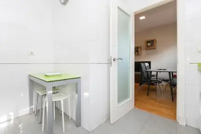 a room with a small table and a table and chairs at La Ronda - Cádiz in Jerez de la Frontera