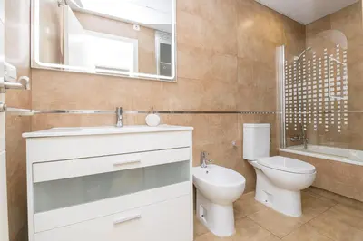 a bathroom with a sink and a toilet and a mirror at La Ronda - Cádiz in Jerez de la Frontera