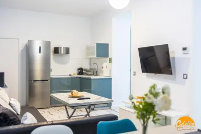 a kitchen with a couch and a table in a room at Casa Lua by Cadiz Time in Cádiz
