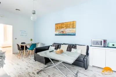 a living room with a couch and a table at Casa Lua by Cadiz Time in Cádiz