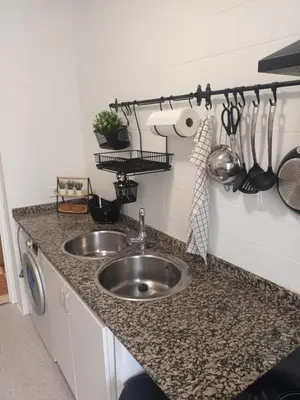 a kitchen with a sink and a counter top at La Garatera in Jerez de la Frontera