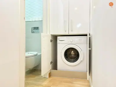 a laundry room with a washer and dryer at La Suite de la Laguna Grupo AC Gestion in Cádiz