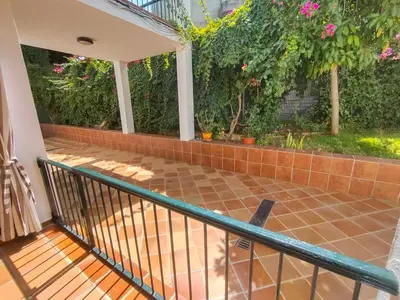 a patio with a fence and a brick wall at Villa Playa in Novo Sancti Petri