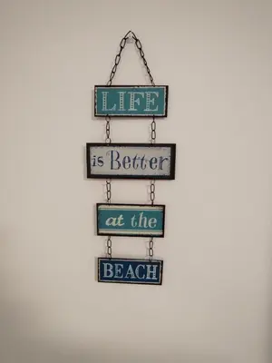 a sign that says life is better at the beach at Villa Playa in Novo Sancti Petri