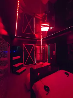 a red room with two beds and red lights at Parque erotico in Jerez de la Frontera