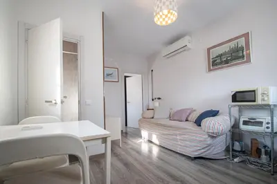 a living room with a couch and a table at Estudio Las Lavanderas de Cádiz in Cádiz