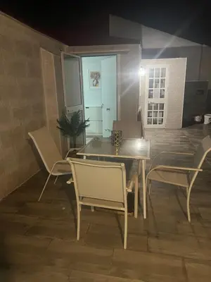 a dining room table and chairs in a room at Dante Suite in Jerez de la Frontera