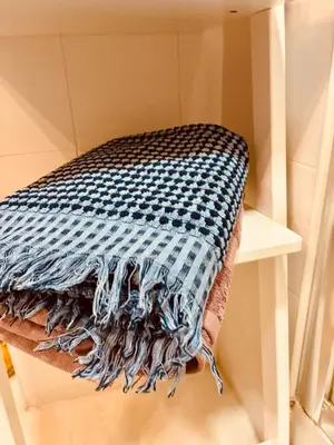 a towel is sitting on top of a shelf at Apartamento Castillo San Marcos in El Puerto de Santa María