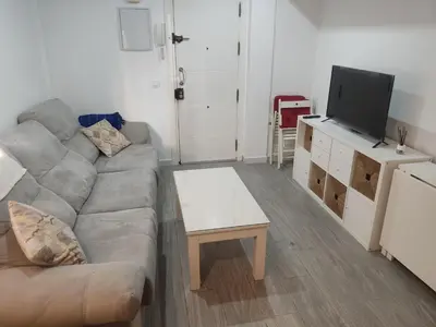 a living room with a couch and a coffee table at Apartamento Santa Teresa in Cádiz