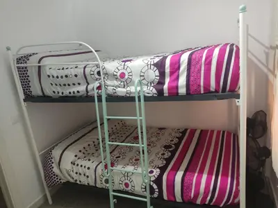 a couple of bunk beds in a room at Apartamento Santa Teresa in Cádiz