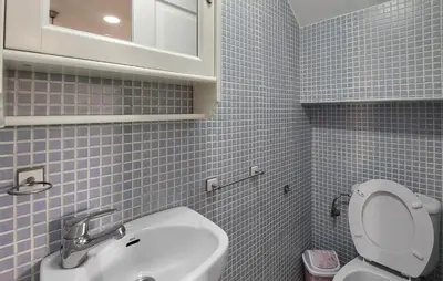 a bathroom with a white sink and a toilet at Awesome Home In Rota With Wifi in Rota